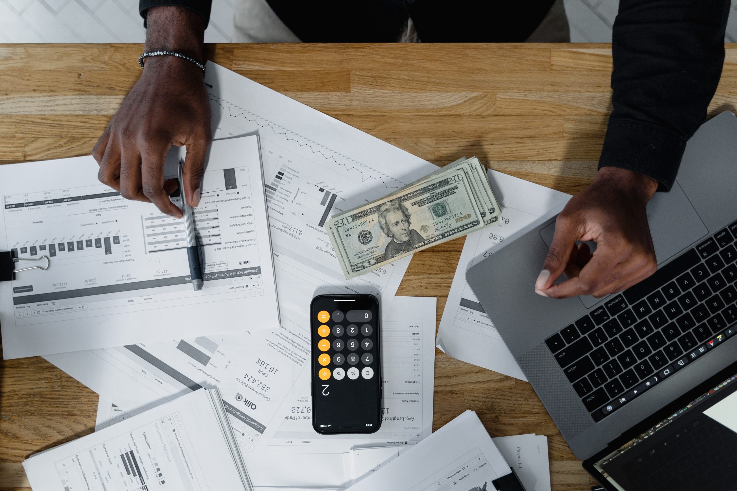 Destiny Capital - Image of a man working on his finances at his desk